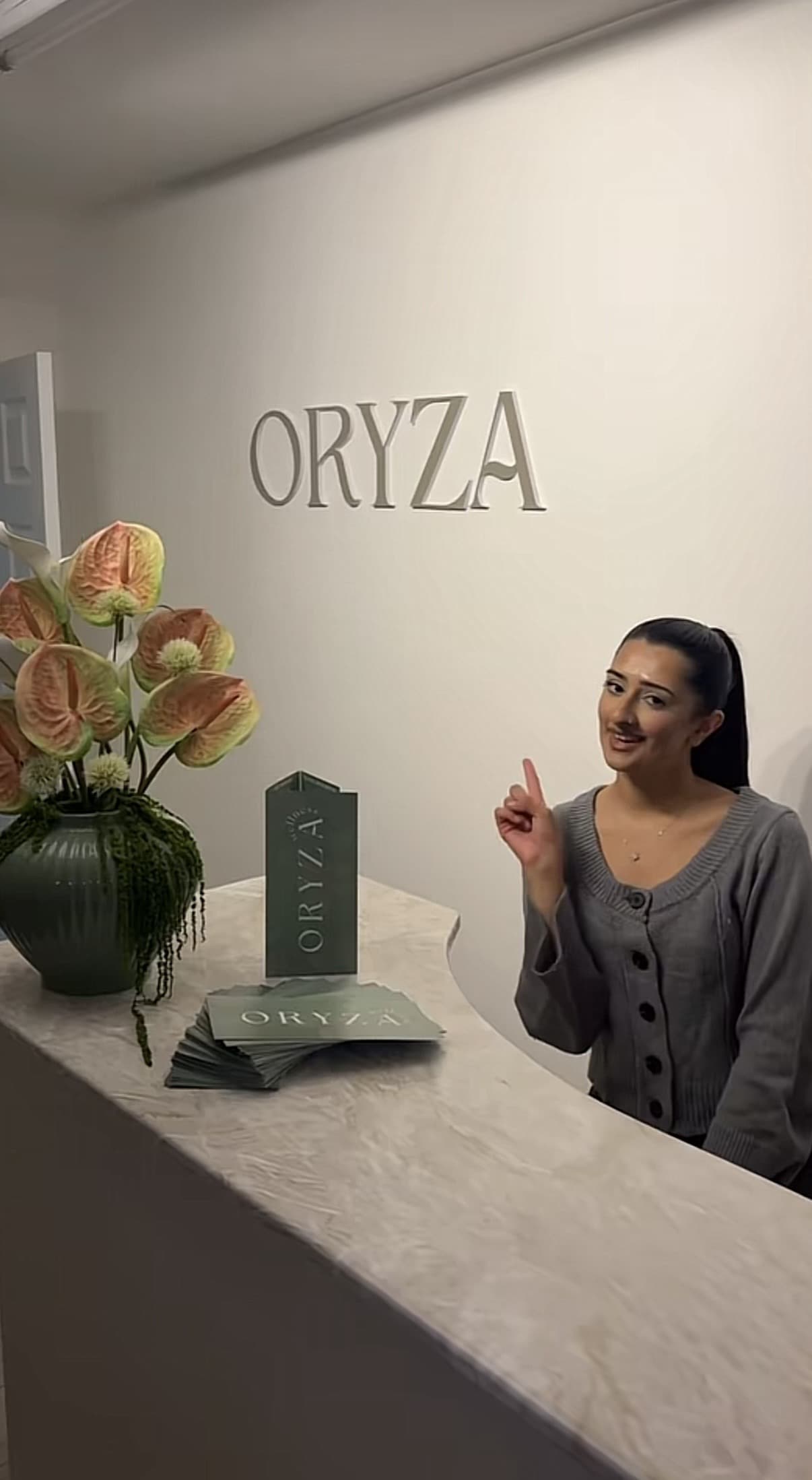 Oryza Wellness owner at the reception desk
